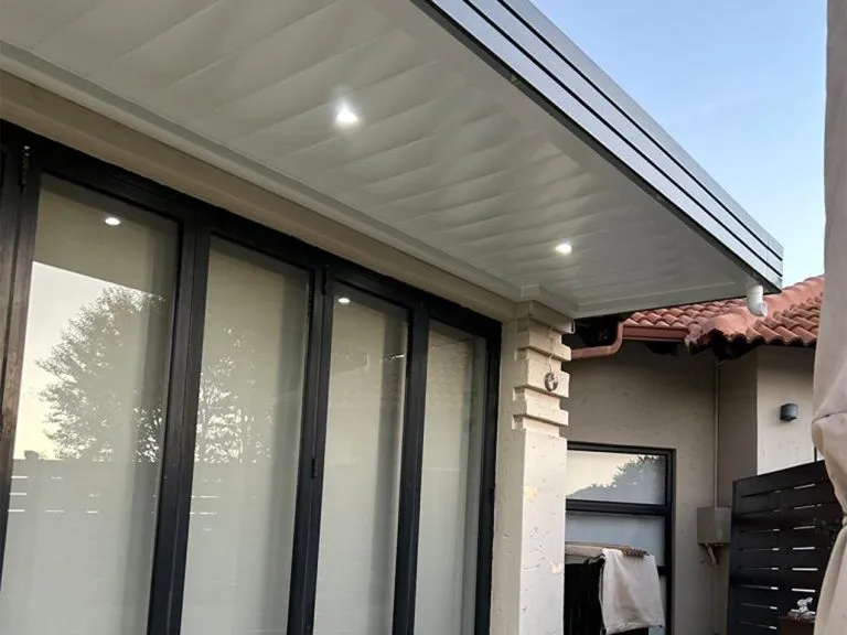 Aluminium patio ceiling roof with a sleek low-maintenance ceiling board finish