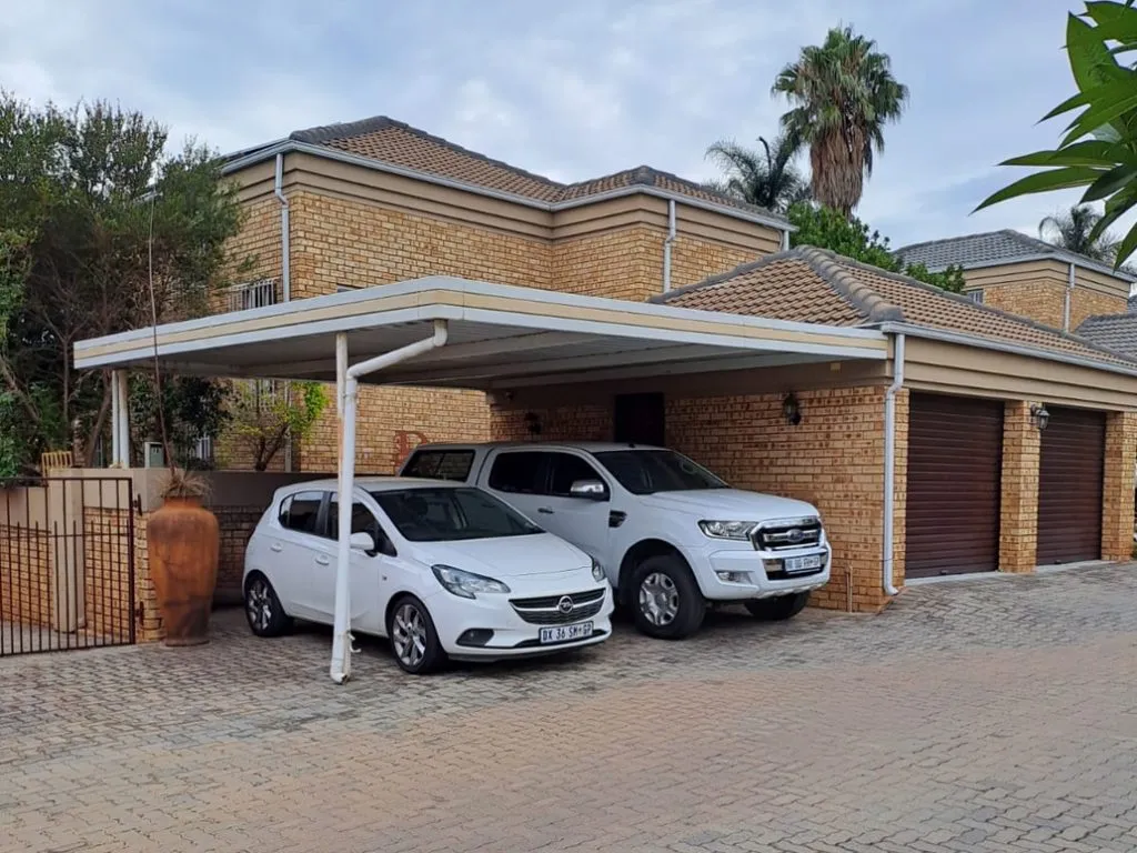 Double aluminium carport installed over a driveway