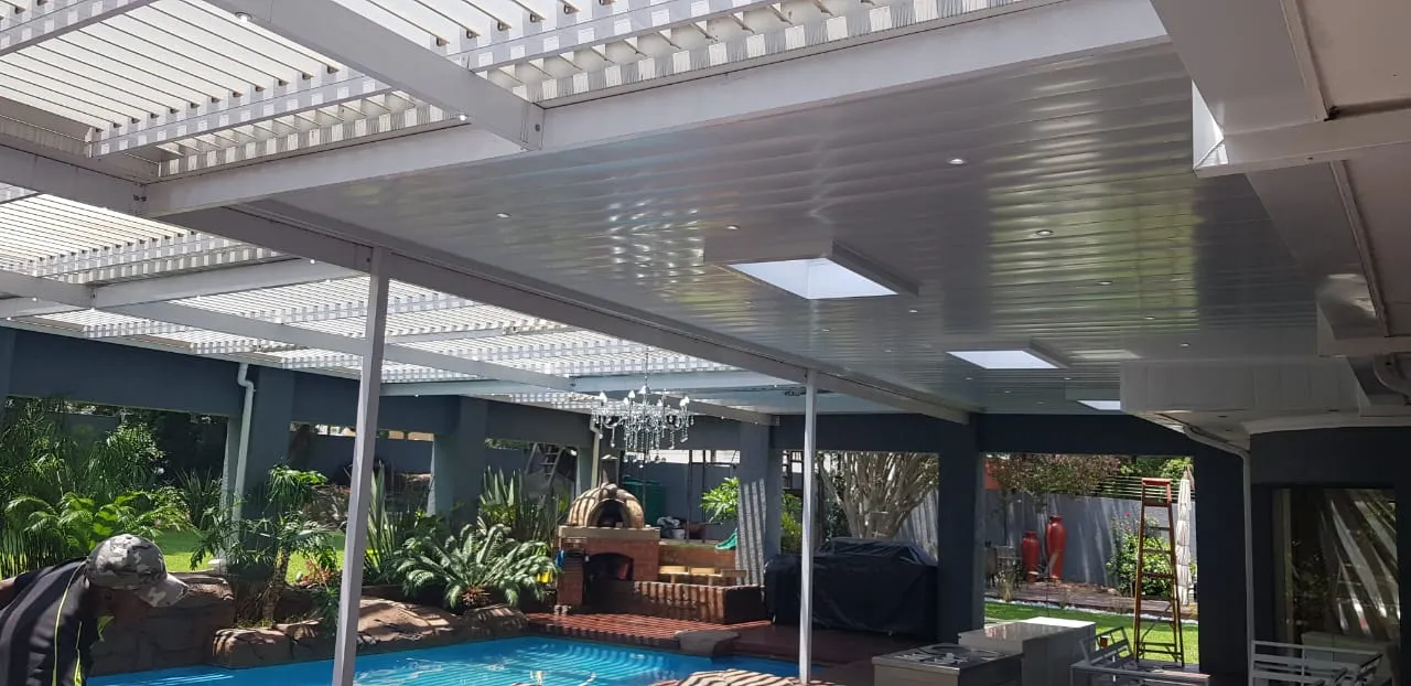 Ceiling and louvre awning with skylights over a poolside entertainment area