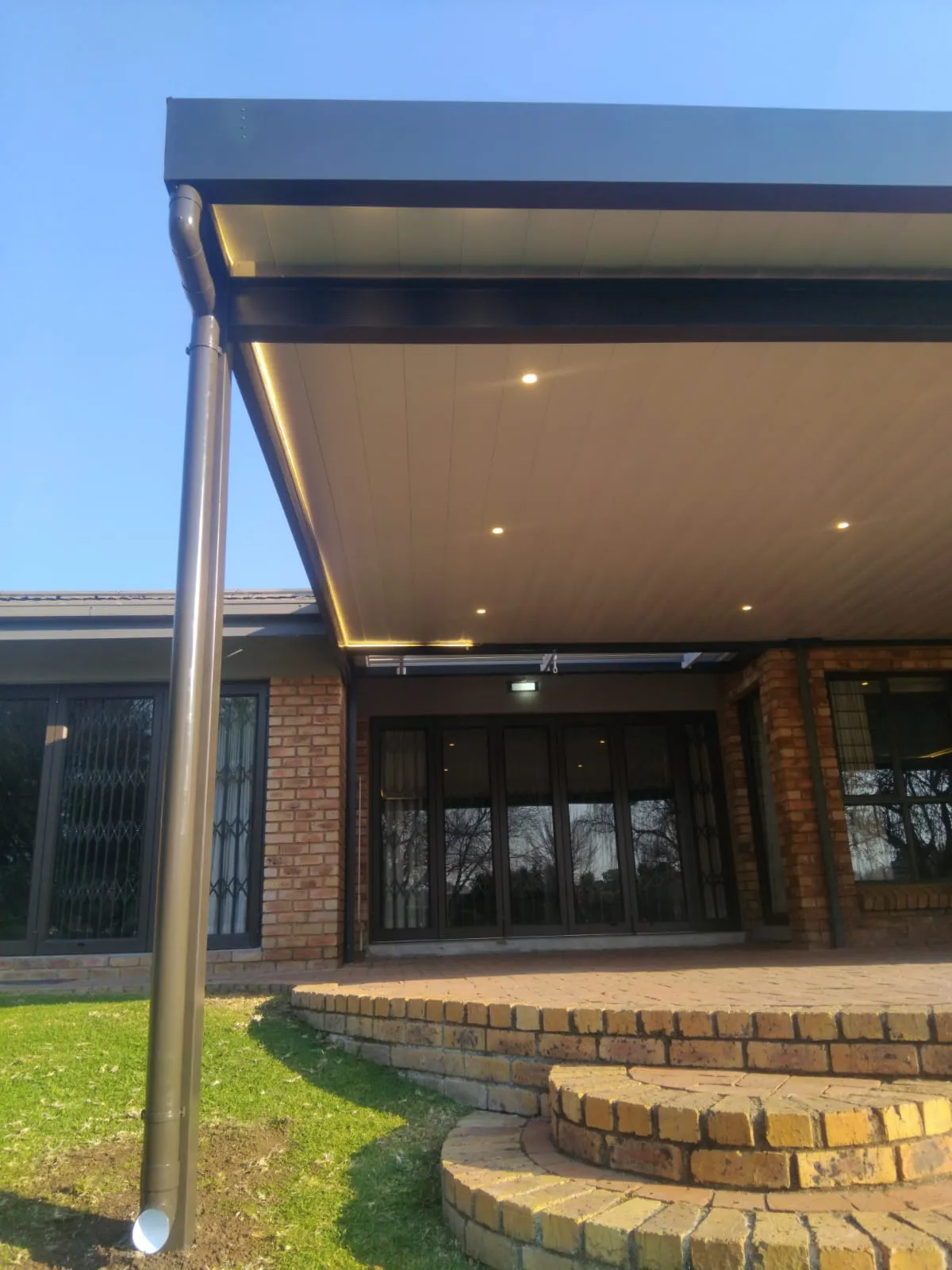 Ceiling awning with charcoal fascia, downlights and LED strip lighting