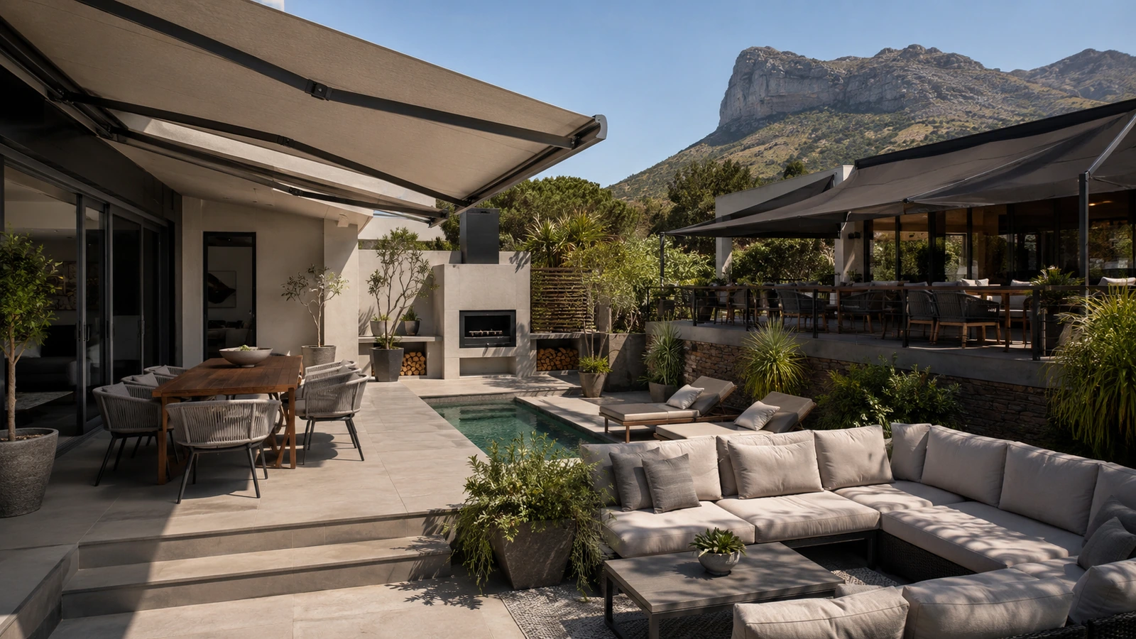 Shaded patio seating area beside a pool in afternoon sunlight