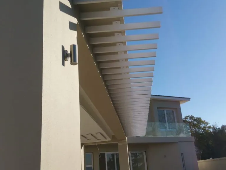 Sun louvre awning creating an enclosed, all-weather outdoor living space